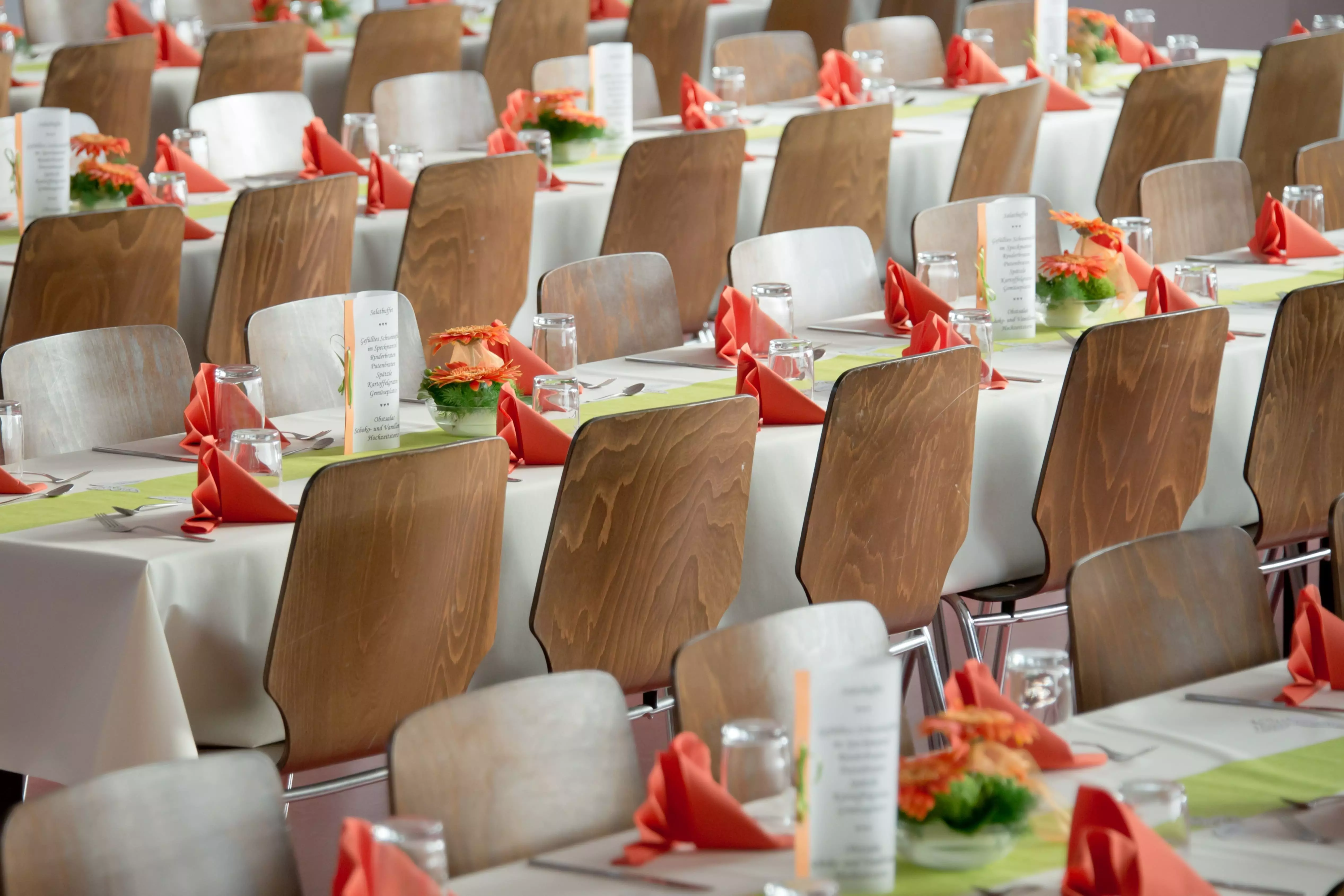 Chairs alligned in rows with wedding theme