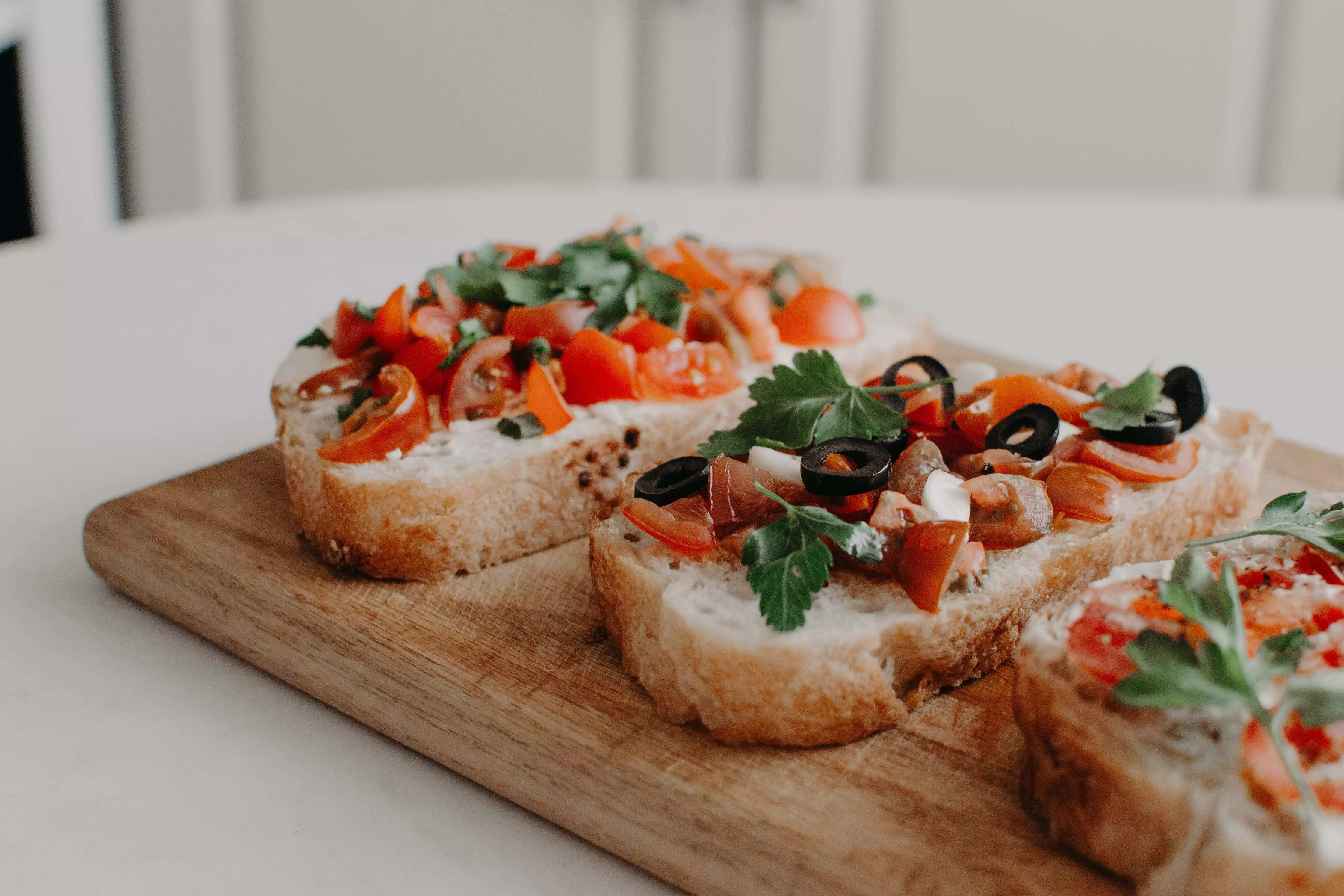 crunchy bruschetta on wooden cutting board